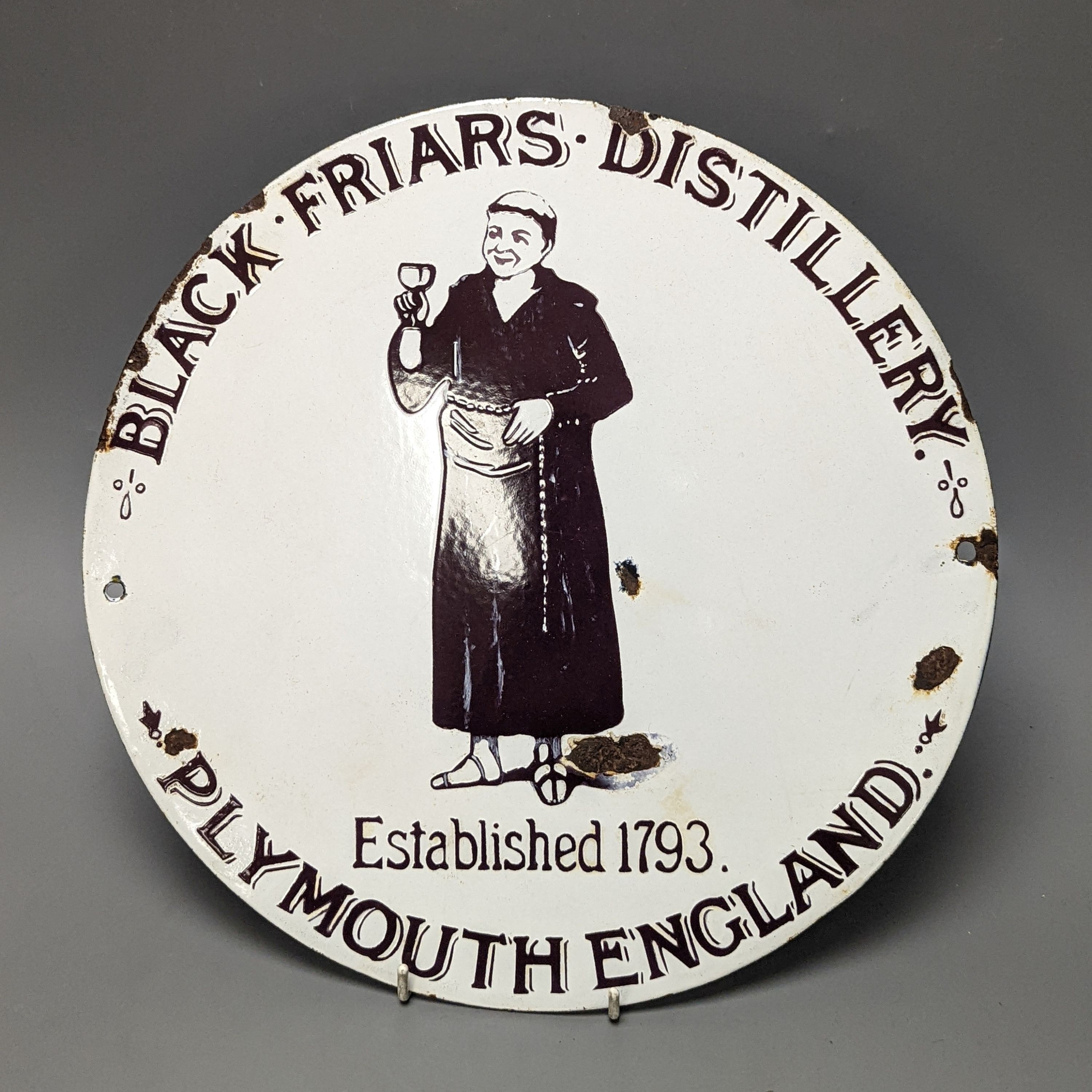 A Blackfriars Distillery enamelled sign., 32 cms diameter.